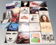 A crate of vinyl records - Blue Oyster Cult, Ted Nugent, Fleetwood Mac, Genesis,