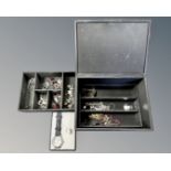 A jewellery box containing costume jewellery,