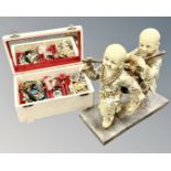 A musical jewellery box containing costume jewellery together with a Chinese resin figure.