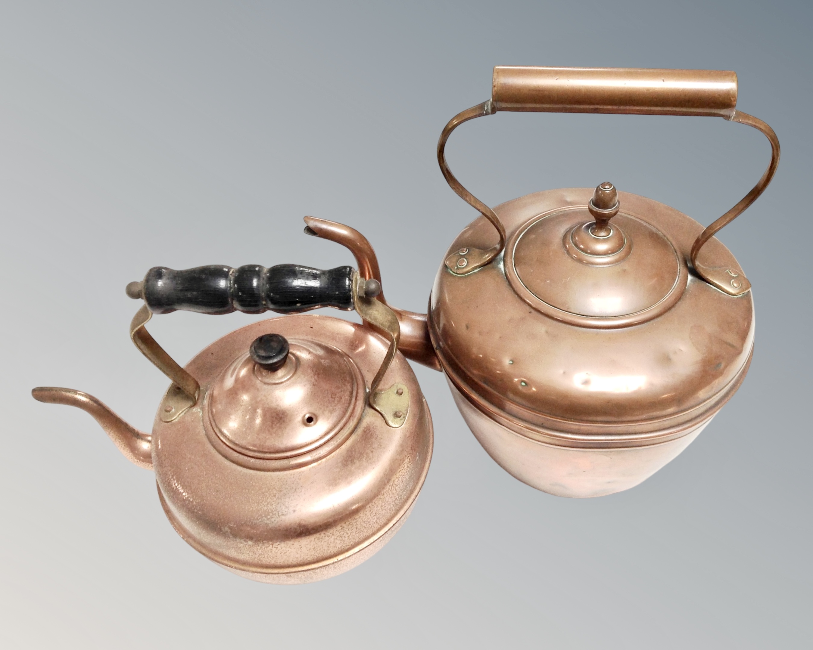 A 19th century copper kettle and further copper kettle