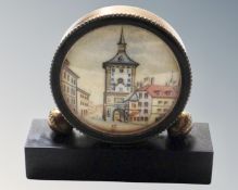 A vintage miniature brass cased desk clock with Swiss movement on marble stand
