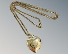 A 9ct yellow gold chain with 9ct heart shaped locket, 7.8g.