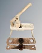 A vintage wooden apple press together with a flax comb