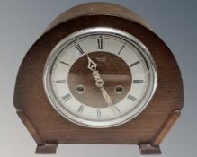 A 1930s oak cased Smiths Enfield eight-day mantel clock.