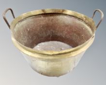 A 19th century brass cast iron handled cooking pot,