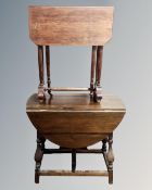 A 20th century beech wood Sutherland table together with a further gate leg table