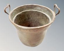 A 19th century copper cast iron handled cooking pot, diameter 35 cm.