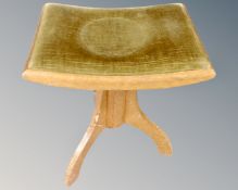 An Edwardian oak pedestal dressing table stool