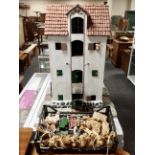 A folk art four tier farmhouse with lift and accessories