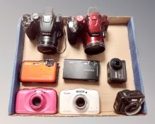 A box of assorted Nikon digital cameras