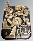 A tray of brass ware, bookends, corkscrew, candlesticks,