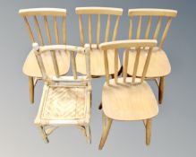 A set of four child's rail backed chair together with a further bamboo and wicker chair