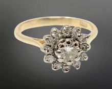 An 18ct gold diamond cluster ring, the central stone approx. 0.