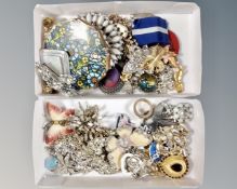 Two boxes of assorted butterfly necklaces, brooches, compacts,