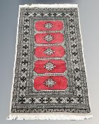 An Afghan/Caucasian rug 93 cm x 153 cm