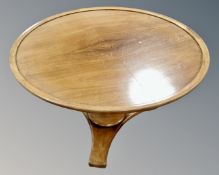A circular walnut Art Deco coffee table