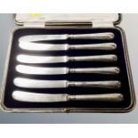 A set of six silver handled butter knives in case, Sheffield marks.