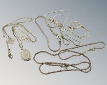 A silver locket on chain, together with seven further silver bracelets and necklaces. 38g.