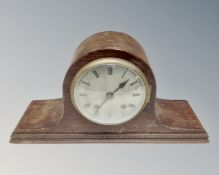 A 1930s eight-day mantel clock with silvered dial.
