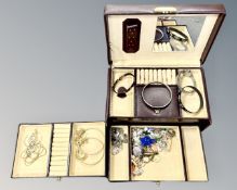 A Burgundy jewellery case containing costume jewellery, bangles etc.