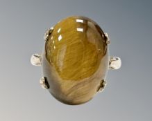 A 9ct yellow gold cabochon tiger's eye ring, size L.