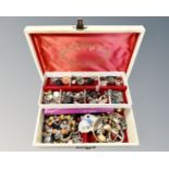 A jewellery box containing costume jewellery,