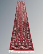 A Bokhara design runner 79 cm x 483 cm