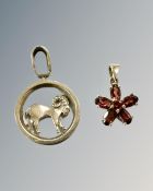 Two 9ct yellow gold pendants, one set with garnets, 3.7g gross.