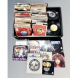 A crate of vinyl 7 inch singles, Wings, The Police, Kate Bush, Fleetwood Mac, PInk Floyd,
