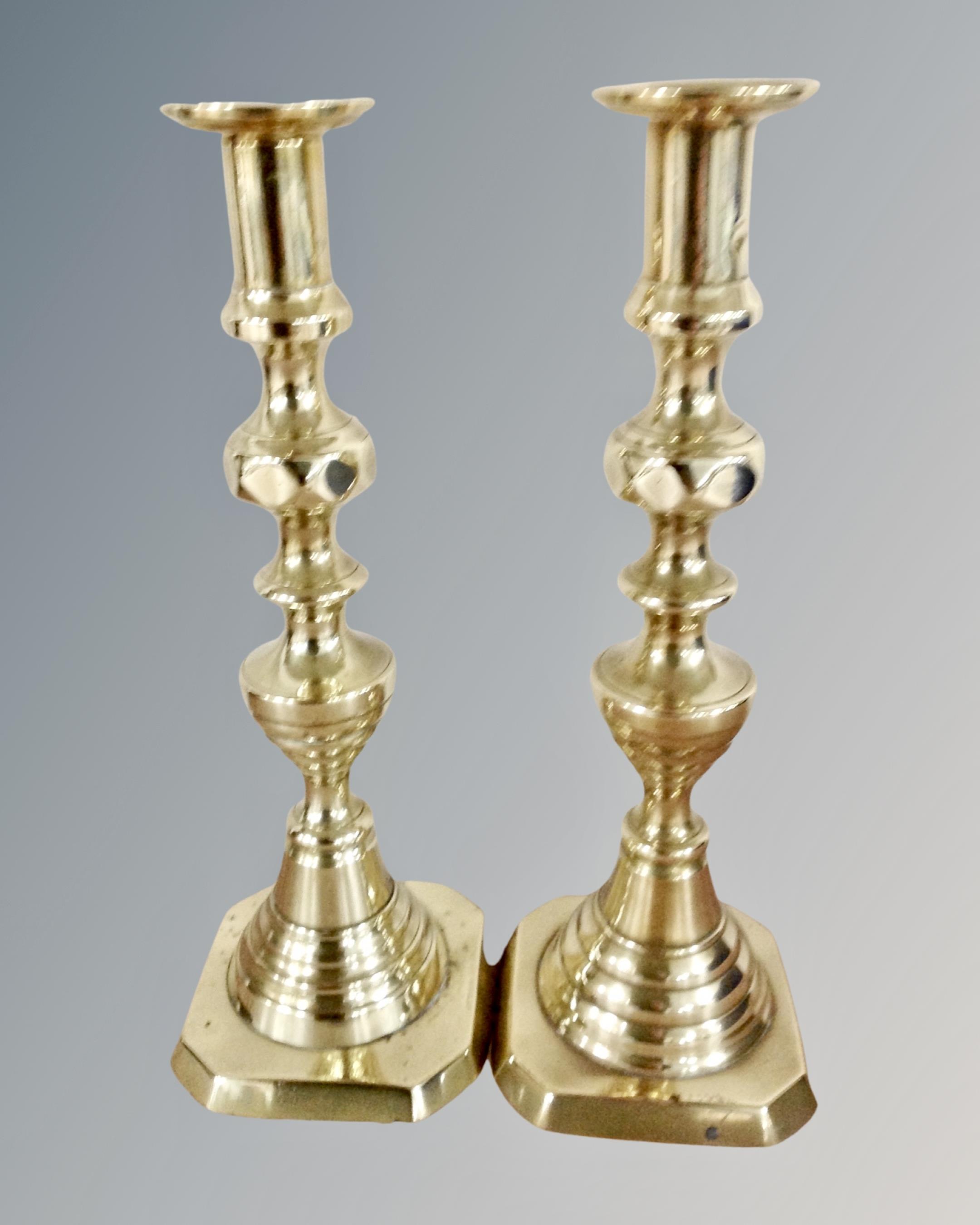 A pair of Victorian brass candlesticks