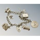 A silver charm bracelet, 55.