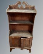 A set of antique carved oak bookshelves