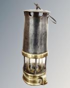 A vintage protector miner's lamp