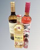 A bottle of Jose Cuervo tequila 50cl together with a rasberry vodka miniature and two bottles of