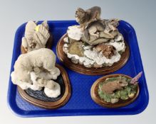 A tray containing four Country Artist's animal figures on wooden plinths.