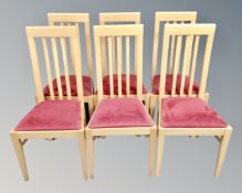 A set of six contemporary rail backed dining chairs