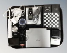 A tray containing assorted electricals including a pocket micro chess set, a Casio LCD pocket TV,