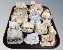A tray containing a collection of Lilliput Lane ornaments.