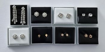 8 boxed Diamante and gold plated earrings.