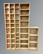 Two narrow Ikea Billy Bookcases together with three further Benno media shelves