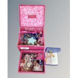 A pink jewellery box containing two sterling silver clasp necklaces,