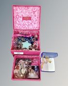 A pink jewellery box containing two sterling silver clasp necklaces,