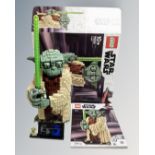 A Lego Star Wars 75255 Yoda with mini-figure box and instructions.