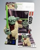 A Lego Star Wars 75255 Yoda with mini-figure box and instructions.