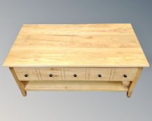 A contemporary oak coffee table fitted a drawer