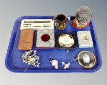 A tray containing a silver and leather pocket watch desk stand, costume jewellery,
