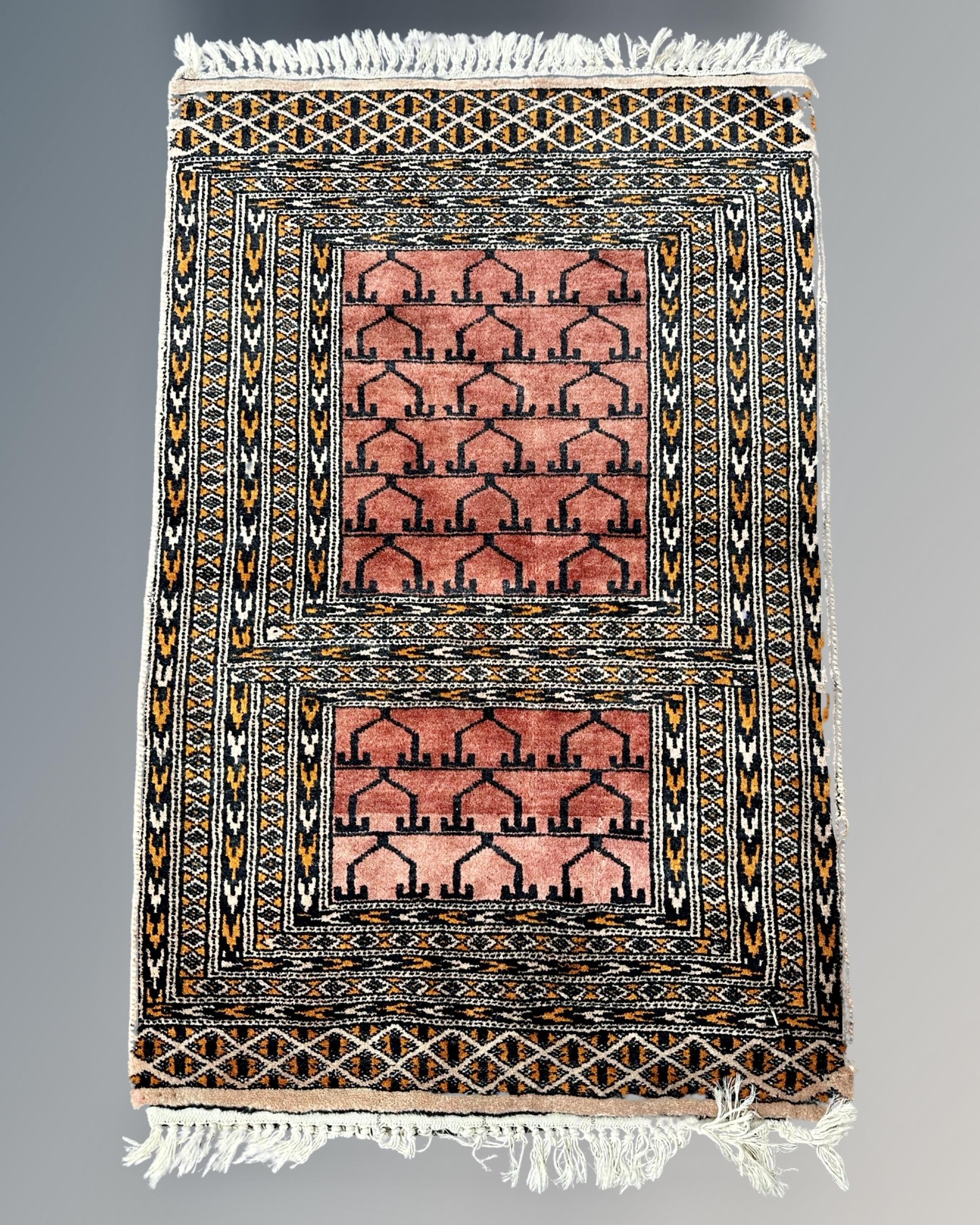 An Iranian prayer rug, 58cm by 86cm.