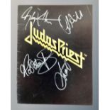 A Judas Priest 1980's concert programme with signatures