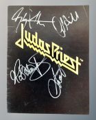 A Judas Priest 1980's concert programme with signatures