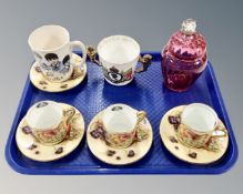 A tray containing a Victorian cranberry glass lidded pot, a Beatles mug,
